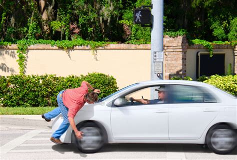 person run over by car|chasing a pedestrian video.